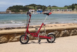 Krys Foldee Mini Electric Bike at the beach