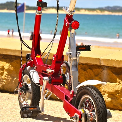 Krys Foldee Mini Electric Bike at the beach